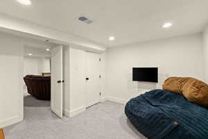 Sitting room featuring light carpet and recessed lighting