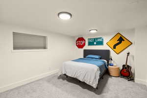 Carpeted bedroom with baseboards