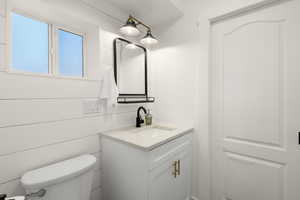 Half bath with vanity and toilet