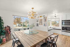 Dining space with a chandelier and light wood finished floors