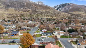 Aerial view of residential area featuring a mountain backdrop