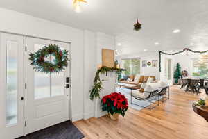Foyer entrance featuring light wood-type flooring and recessed lighting