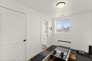Exercise room featuring baseboards