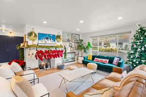 Living area featuring wood finished floors and recessed lighting