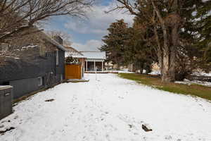 View of yard covered in snow