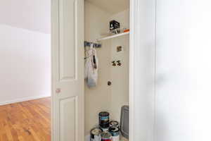 Bathroom featuring light wood-style flooring and baseboards