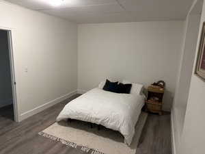 Bedroom with dark wood-style floors