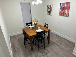 Dining room with wood finished floors and baseboards