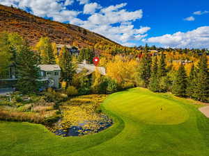 View of home's community featuring a putting area