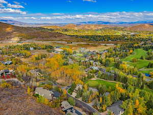 Aerial view of residential area featuring mountains