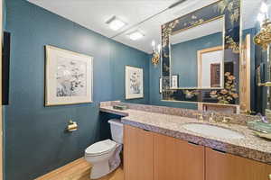 Bathroom with vanity and light wood-type flooring