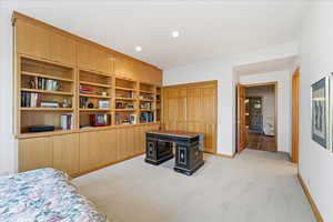 Bedroom with light carpet, a closet, and recessed lighting