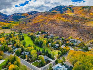 Aerial perspective of suburban area with a mountainous background