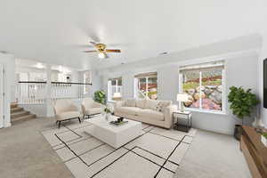 Living room featuring light carpet, ceiling fan, and stairway
