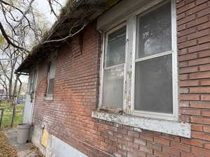 View of side of home with brick siding