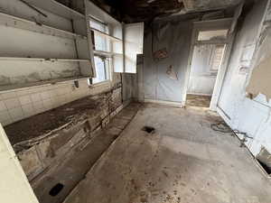 Kitchen featuring white cabinetry