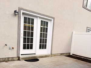 View of exterior patio entry. Garden area to the right. Faucet and natural gas grill hookup.