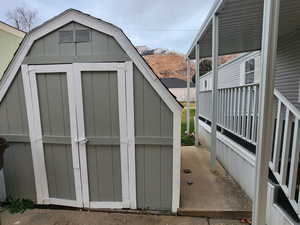 View of shed with a mountain view
