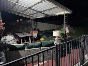 Patio at twilight featuring outdoor dining area