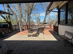 View of patio / terrace featuring a deck and outdoor dining area