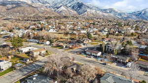 Aerial perspective of suburban area featuring a mountainous background