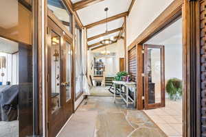 Foyer entrance with stone tile flooring