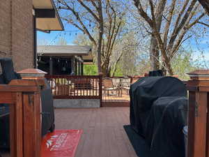 Deck with area for grilling and outdoor dining area