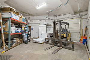 Garage featuring a heating unit