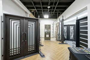 Workout area featuring french doors