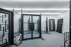 Exercise area featuring a textured ceiling and carpet flooring