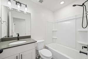 Bathroom with shower / bath combination and vanity