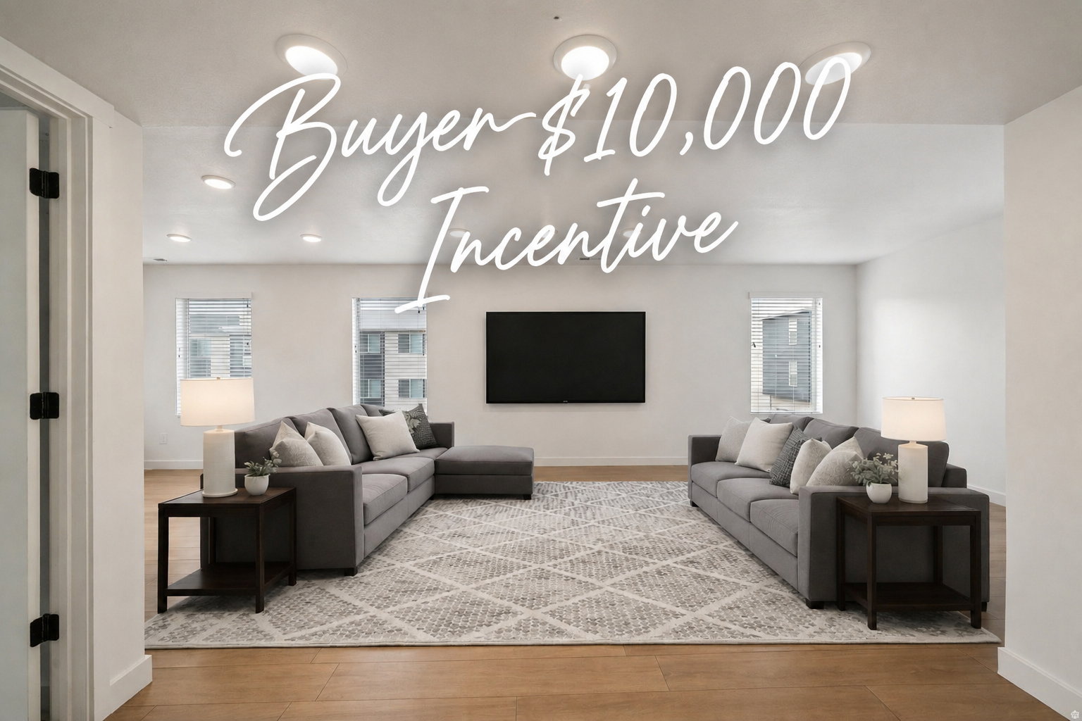 Open-concept living area featuring wood-finish flooring throughout