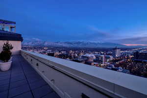 Balcony featuring a view of city and a mountain view