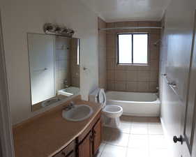 Bathroom with  shower combination, light tile patterned flooring, and vanity