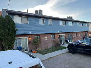 Colonial-style house with brick siding and BRAND NEW vinyl siding