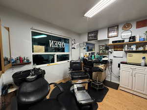 Misc room with a desk and light wood-style flooring