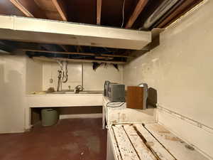 Unfinished basement featuring a sink