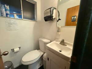Bathroom with a textured wall and vanity