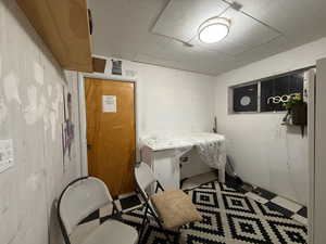 Office area with tile patterned floors