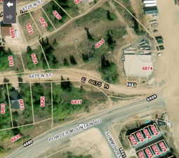 Aerial map of property and surrounding area featuring property parcel outlined