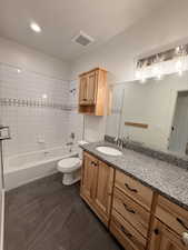 Main Full bath with shower / tub combination and vanity