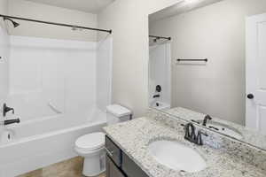 Bathroom with shower / bathtub combination and vanity