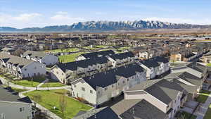 Aerial view of residential area featuring a mountain backdrop