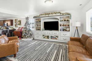 Living area with healthy amount of natural light and light carpet