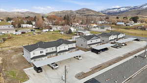 Aerial perspective of suburban area with a mountainous background