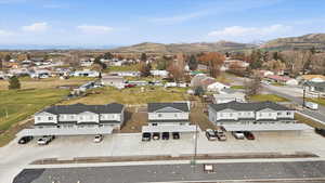 View of property location featuring nearby suburban area and a mountain backdrop