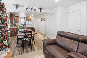 Dining area with recessed lighting and light wood-style floors