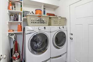 Washroom with washing machine and clothes dryer