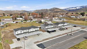 Aerial perspective of suburban area featuring a mountainous background