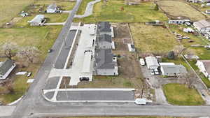 Aerial overview of property's location featuring nearby suburban area